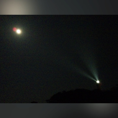 Looking at Kannonzaki Lighthouse walking in the night